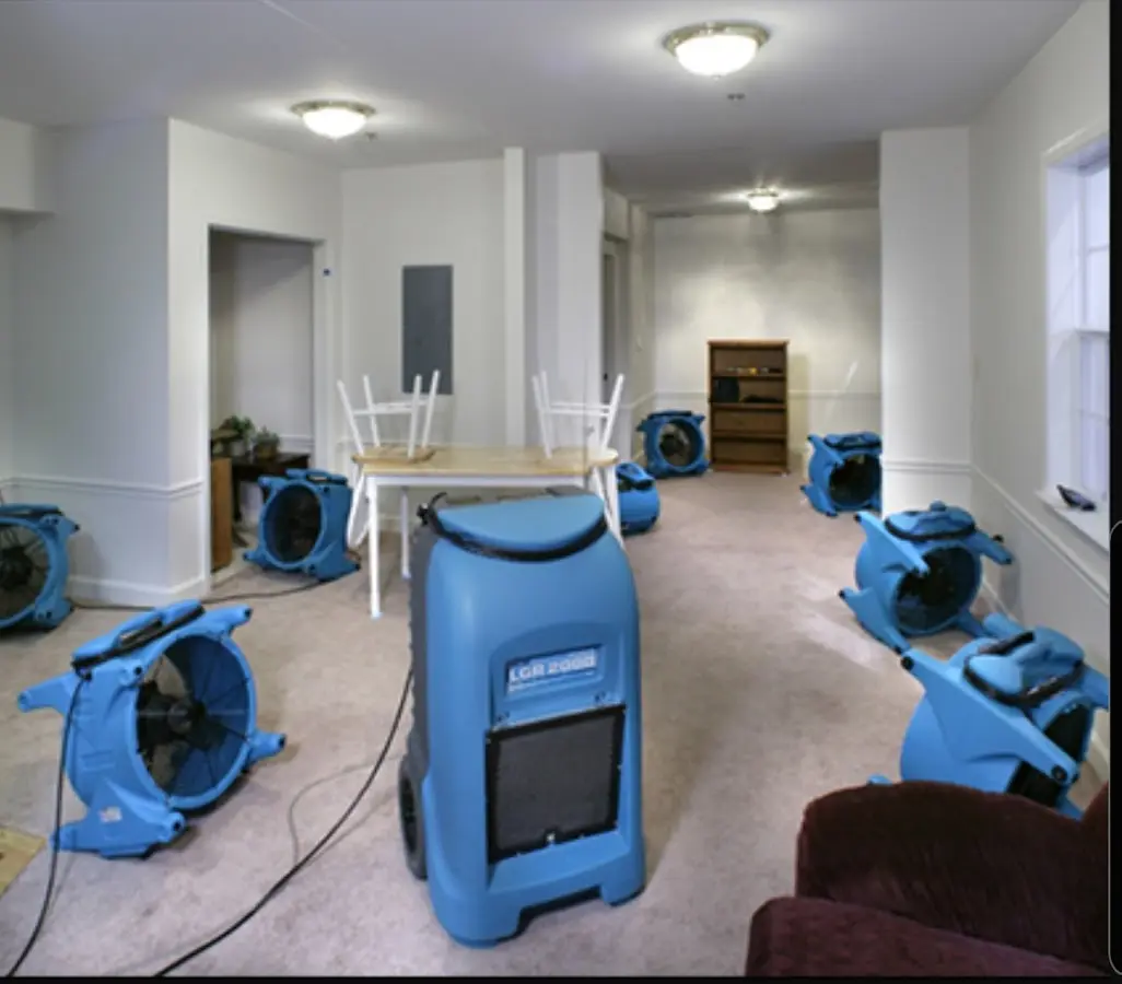 Air movers and dehumidifier setup for Water Damage Restoration in Okeechobee